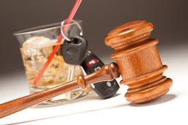 Whiskey, car keys, and judge's gavel 