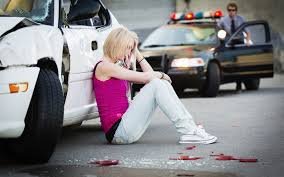 Girl Sitting on the Road After an Accident